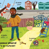 A page from 'Mis primeras palabras - Baby's First Words' featuring a father and his child on a swing and all the things in their yard labeled in Spanish and English.
