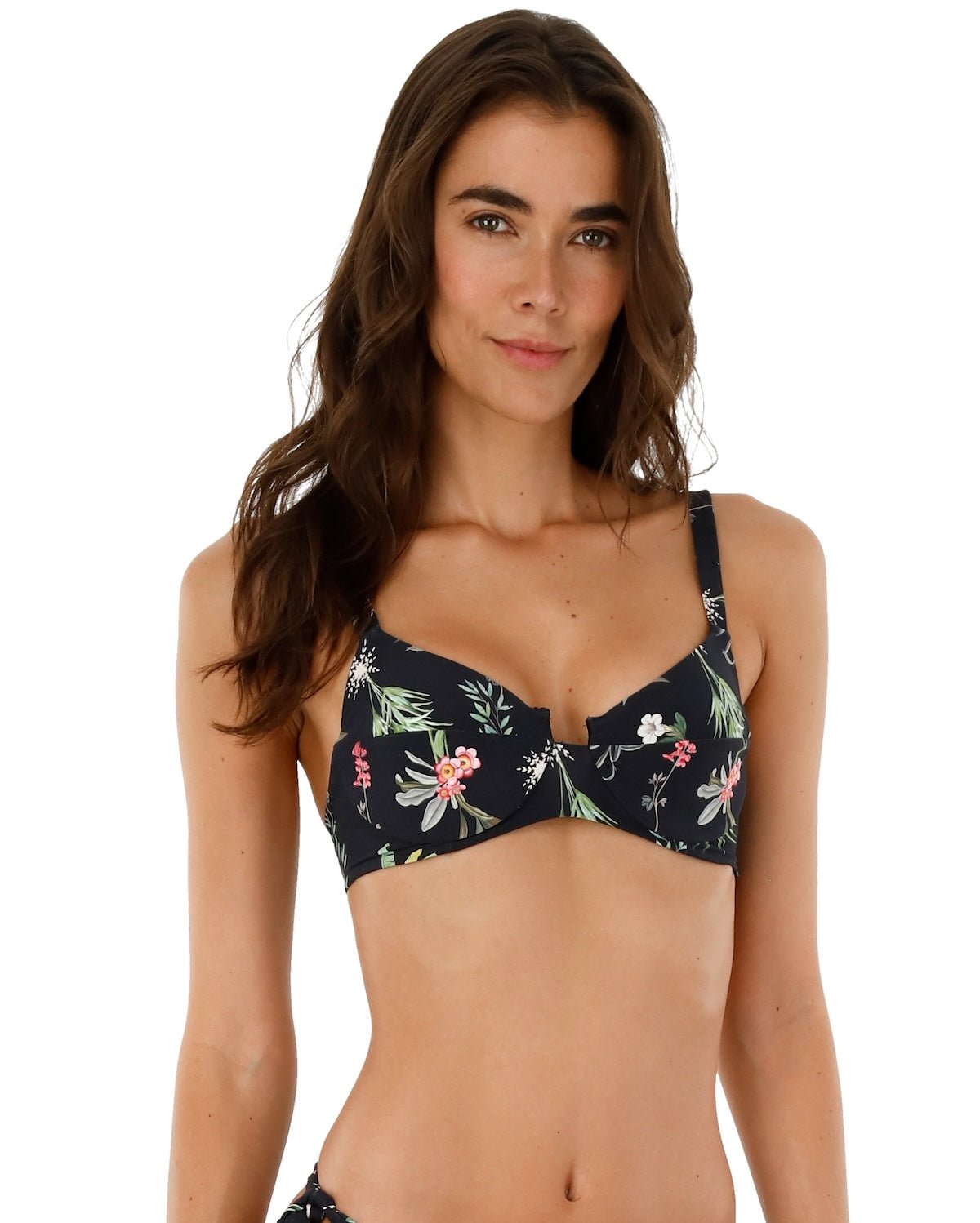 Close up image of a woman. She's wearing a swimsuit with flowers. The purpose of this image is to highlight the swimsuit.