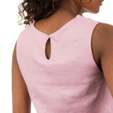 Close up image of a woman wearing a linen top and pants. She's standing behind a white background. The purpose of this image is to highlight the clothing, which is made in Colombia and sold at EVAMAIA Boutique in Studio City, CA.