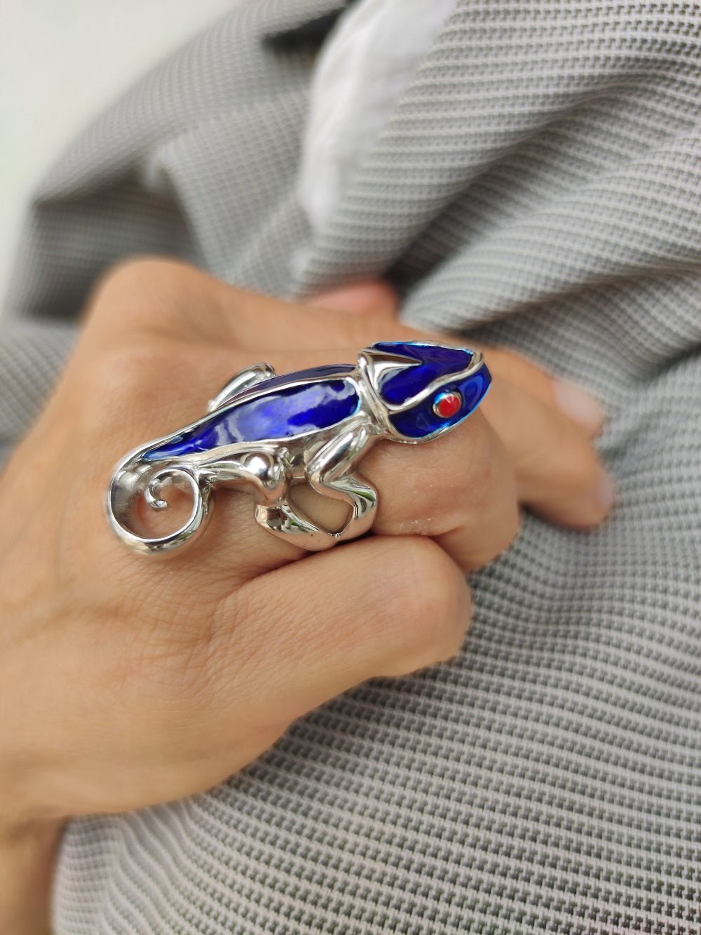 Woman modeling blue chameleon ring