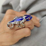 Woman modeling blue chameleon ring