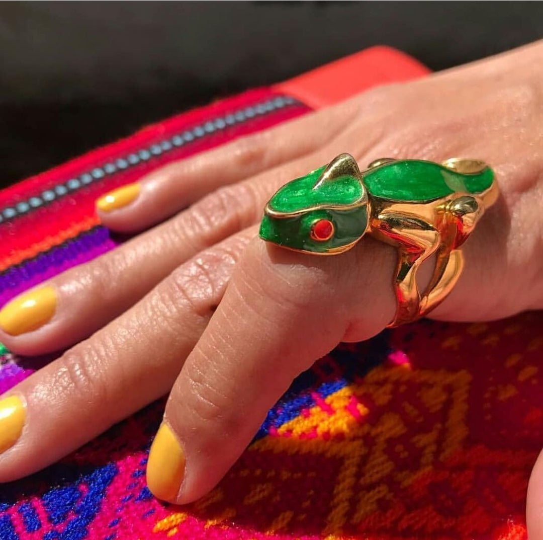 Woman modeling Green Chameleon Ring on table