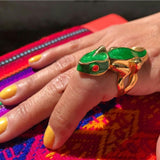 Woman modeling Green Chameleon Ring on table