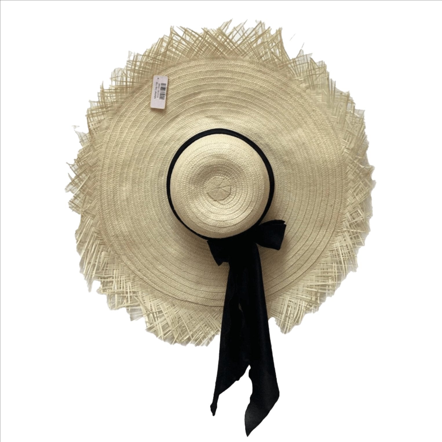 An oversized beige hat with a black satin band, displayed against a white background.