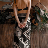 Women modeling black nazar wrap dress