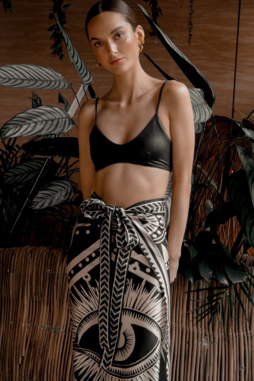 Women modeling black nazar wrap skirt