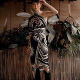 Women modeling black nazar wrap dress