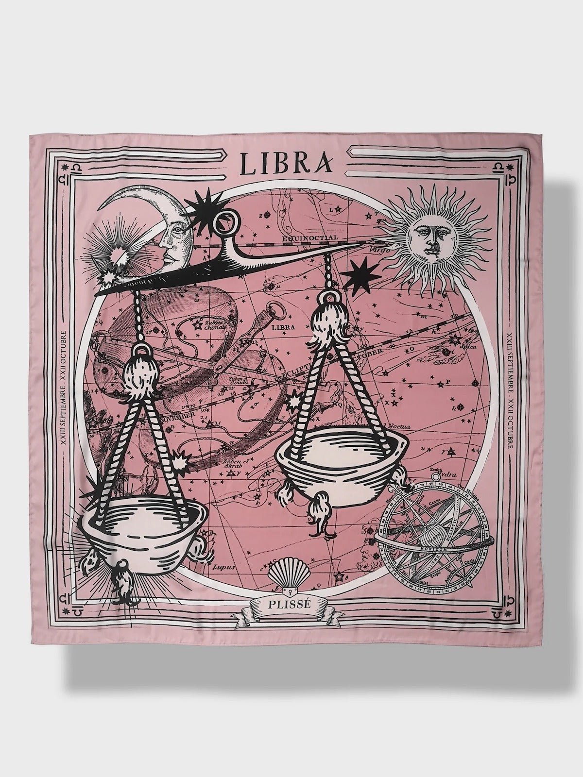 Zodiac Scarf for Libra made by Plissé. Image of scales. It is on top of a astrological background. Details like a white ecliptic, sun, and moon. The scarf is pink with white details displayed on plain background.