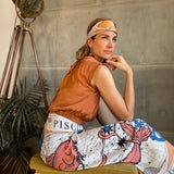 Woman modeling the Zodiac Scarf for Pisces as a skirt