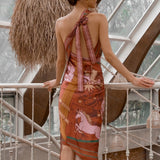Back of Earth Zodiac Wrap Dress on model leaning against fence