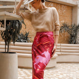Woman modeling Fire Zodiac Wrap Dress wearing crewneck