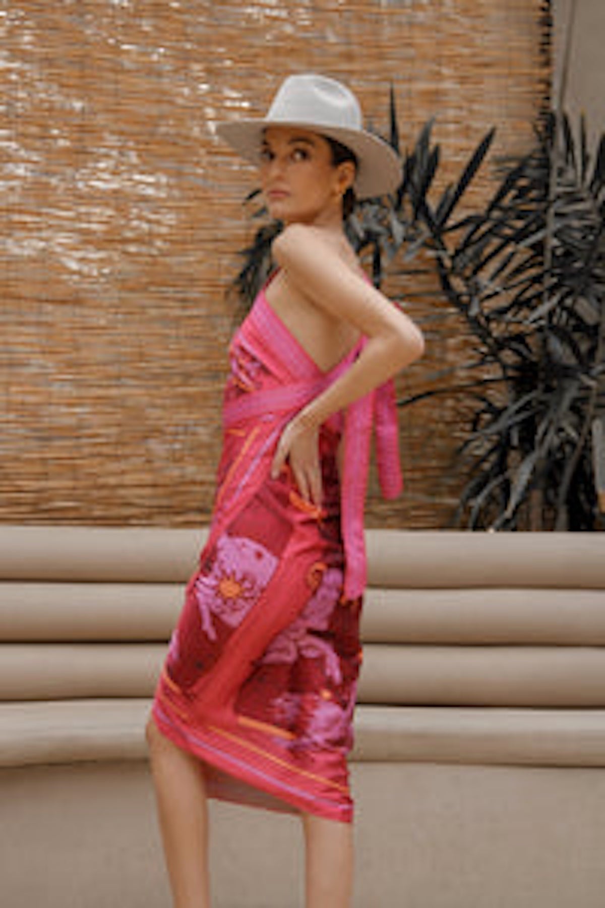 Side of Woman modeling Fire Zodiac Wrap Dress standing on stairs
