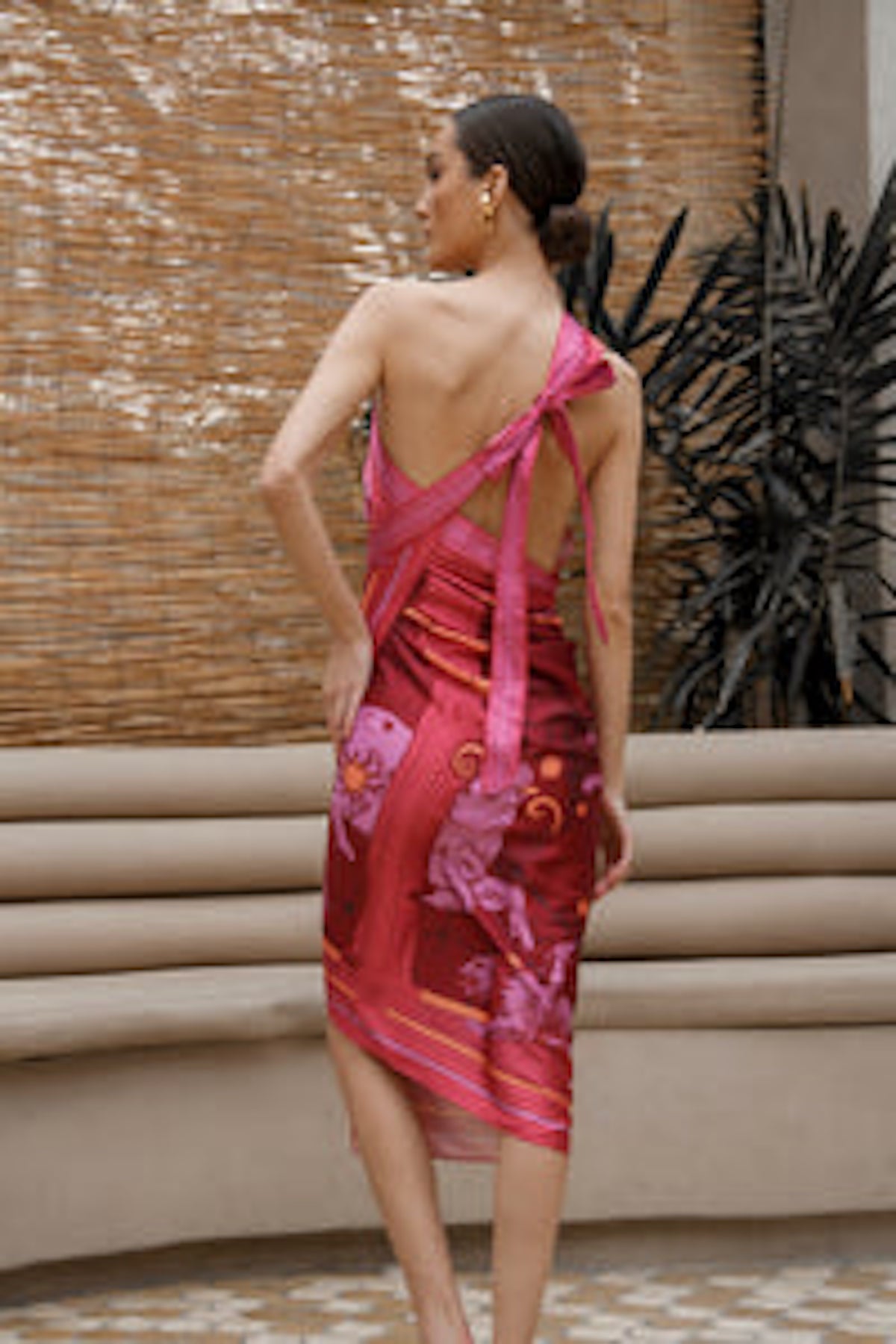 Back of Woman modeling Fire Zodiac Wrap Dress