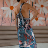 Model posing in Air Zodiac Wrap Dress with arm on hip
