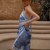 Side of Woman modeling Water Zodiac Wrap Dress