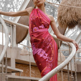 Woman modeling Fire Zodiac Wrap Dress standing on stairs