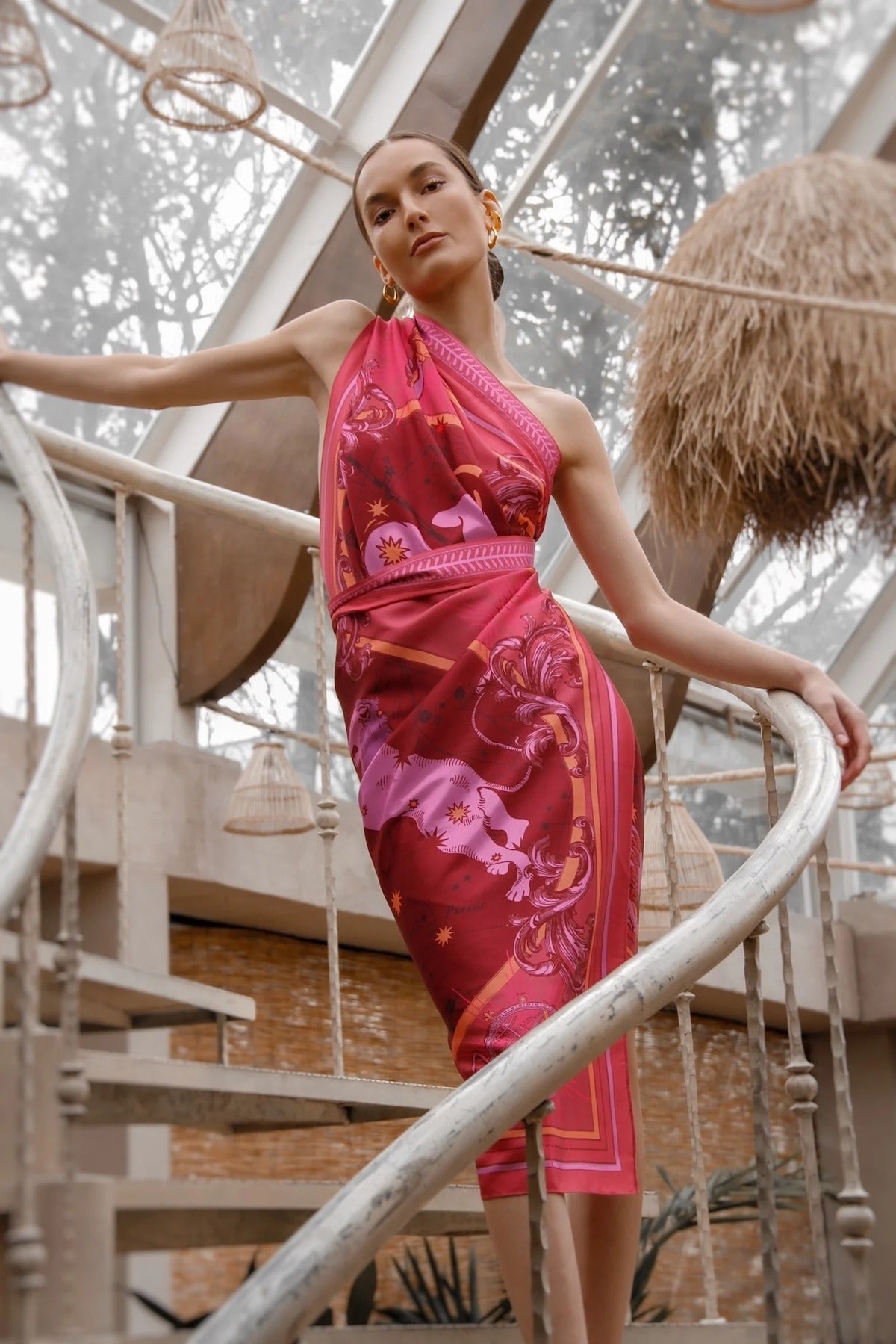 Woman modeling Fire Zodiac Wrap Dress standing on stairs
