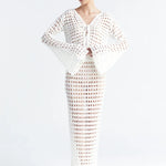 Matching white crochet top and skirt on a white background.