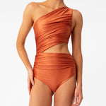 Diana orange one-shoulder one-piece swimsuit by Encantadore with ruching and side cutout. Available at EVAMAIA in Studio City, Los Angeles.
