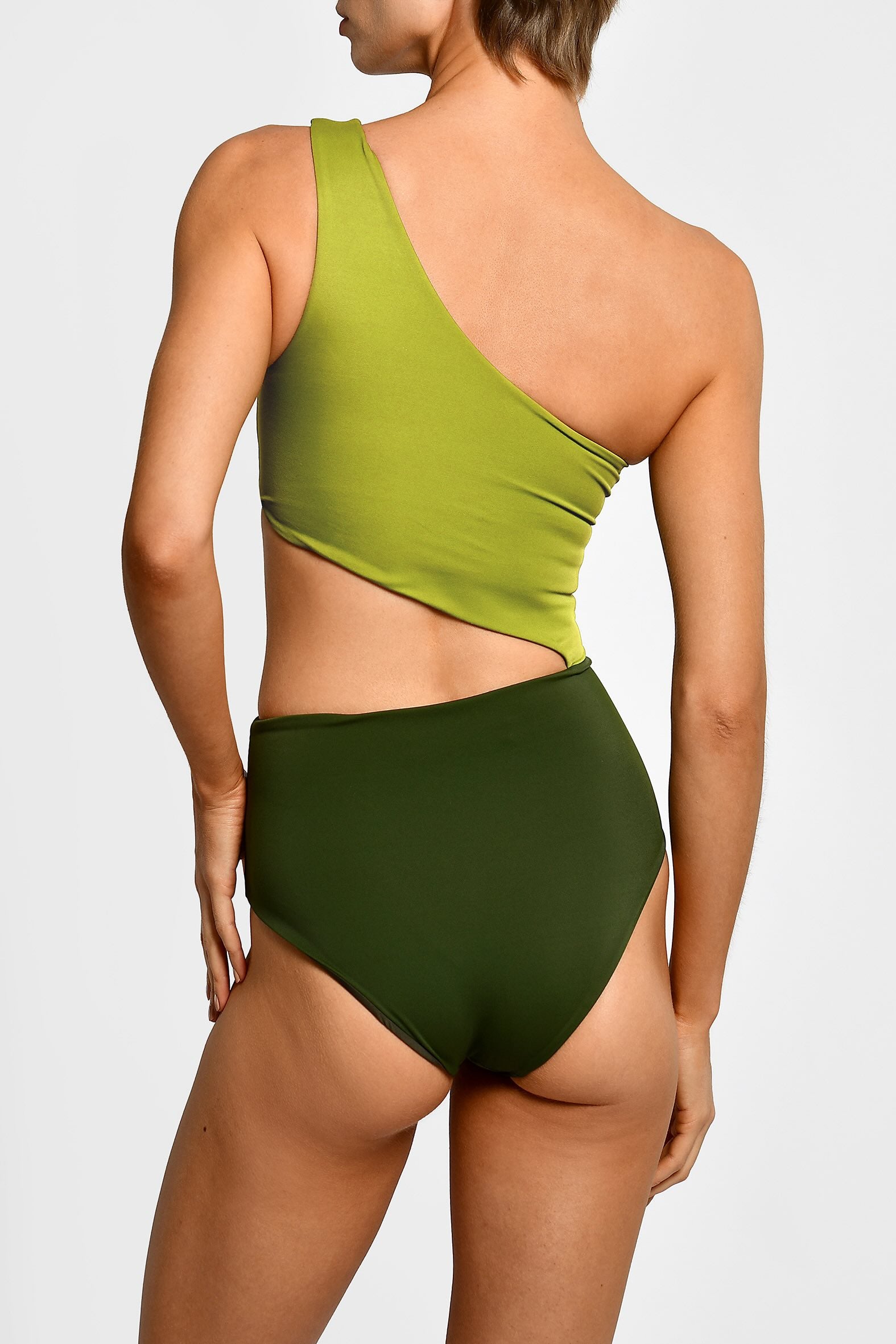 Green one-shoulder swimsuit with rouching and side cut. 