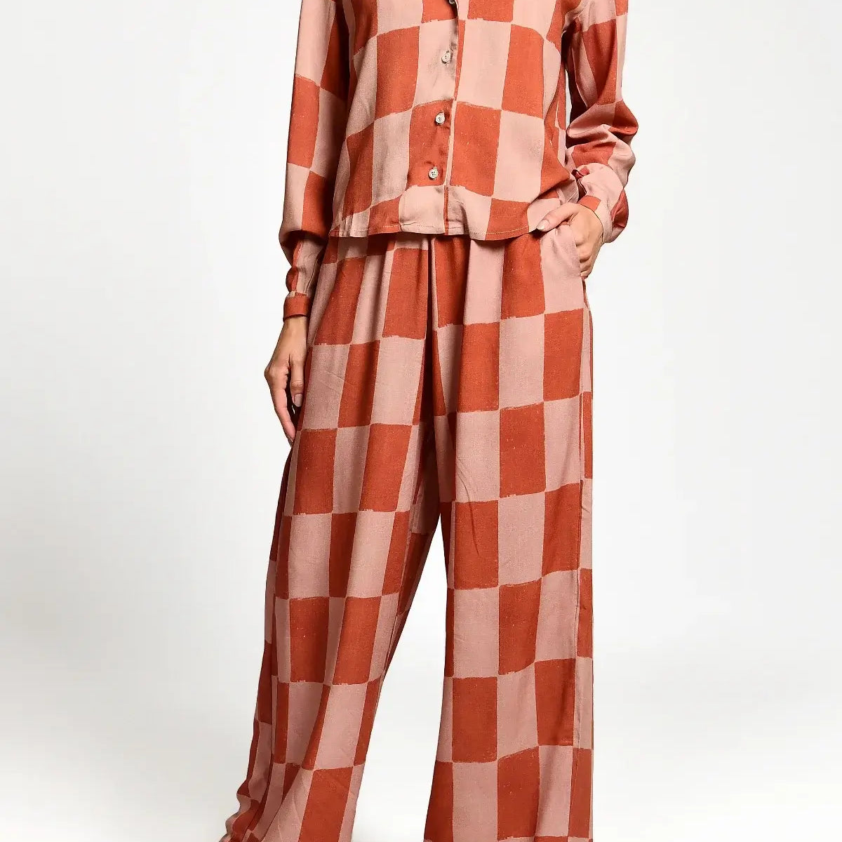 Checkered outfit with a shirt and pants on a white background.