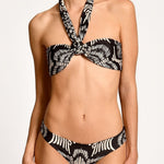 Black and white patterned bikini on a plain background.