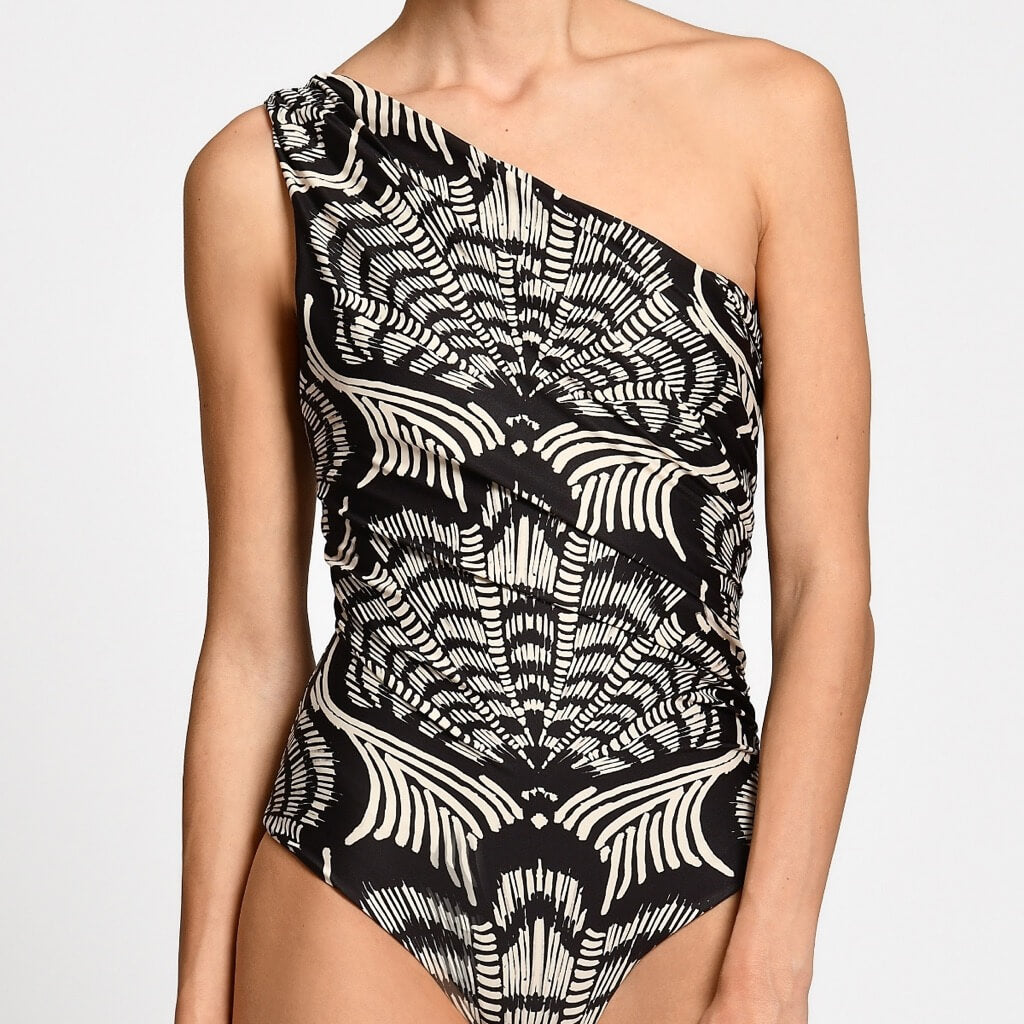 Black and white patterned one-shoulder swimsuit on a plain background.