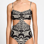 Black and white patterned swimsuit on a plain background.