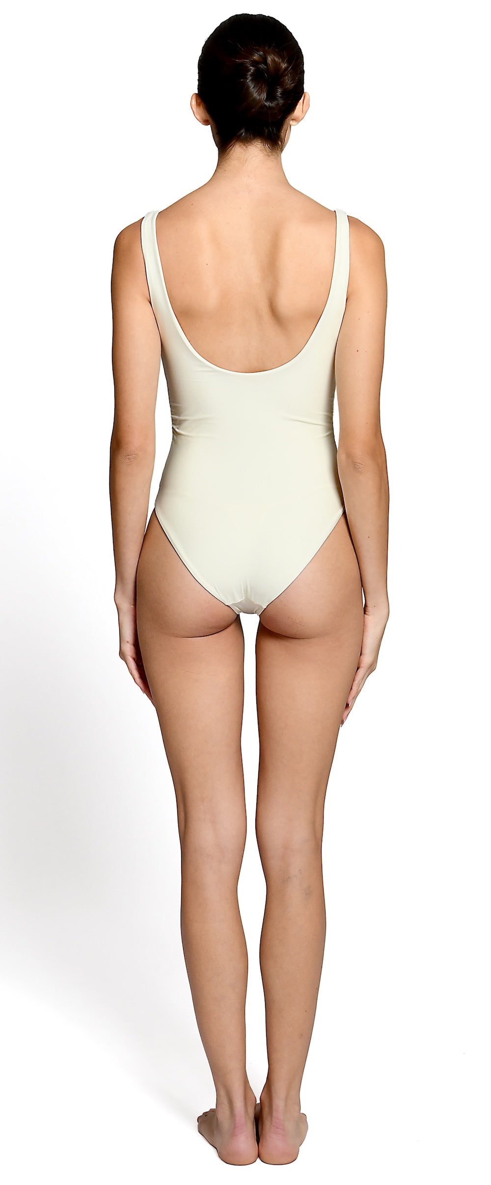 Model wearing ivory one piece swimsuit for EVAMAIA Swimwear.
