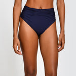 Navy blue high-waisted bikini bottom on a plain background
