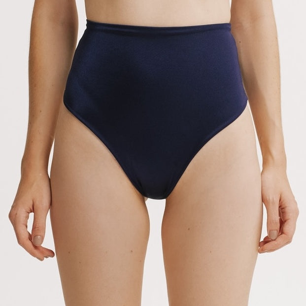 Navy high-waisted bikini bottom on a white background.
