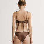 Brown bikini with a bow detail on a white background.