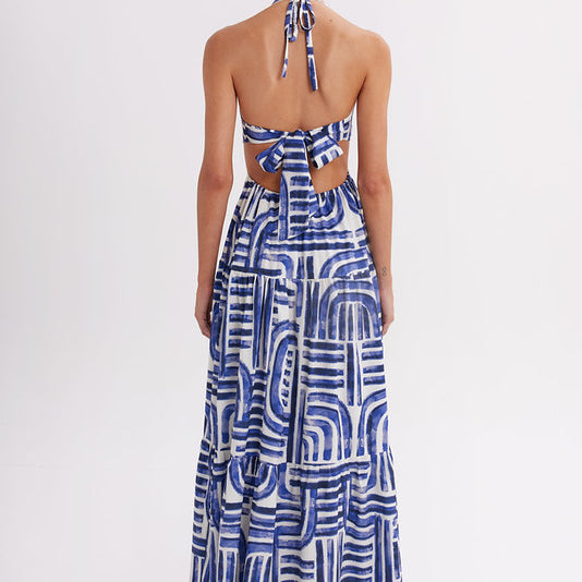 Full-length halter maxi dress in blue abstract print, made in Colombia, available at EVAMAIA
