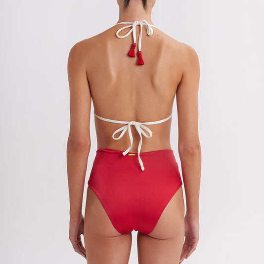 Red bikini with white straps on a plain background