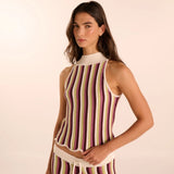 Woman wearing a hand-knit pant and shirt set. Available at EVAMAIA boutique in Studio City.