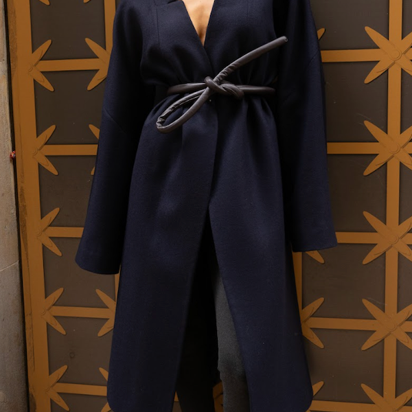Model wearing a navy wool coat
