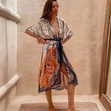 Woman wearing a floral and tiger print kimono.  