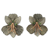 Pair of floral earrings with green and gold details on a white background
