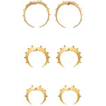 Set of gold crescent hoop earrings on a white background.