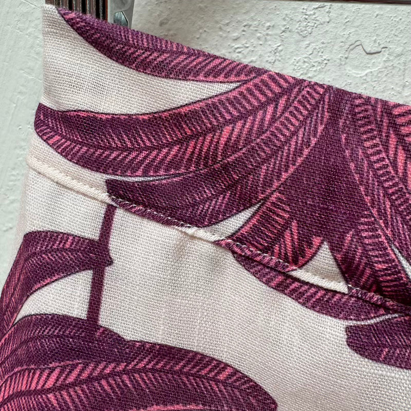 Close up image of the Claudette shorts by Mar de Lua. These shorts are on a hanger. The purpose of this image is to highlight the shorts.