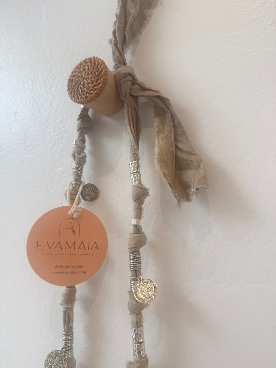 Decorative necklace with natural silver elements on a light background