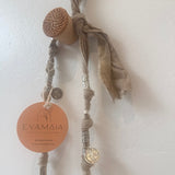 Decorative necklace with natural silver elements on a light background