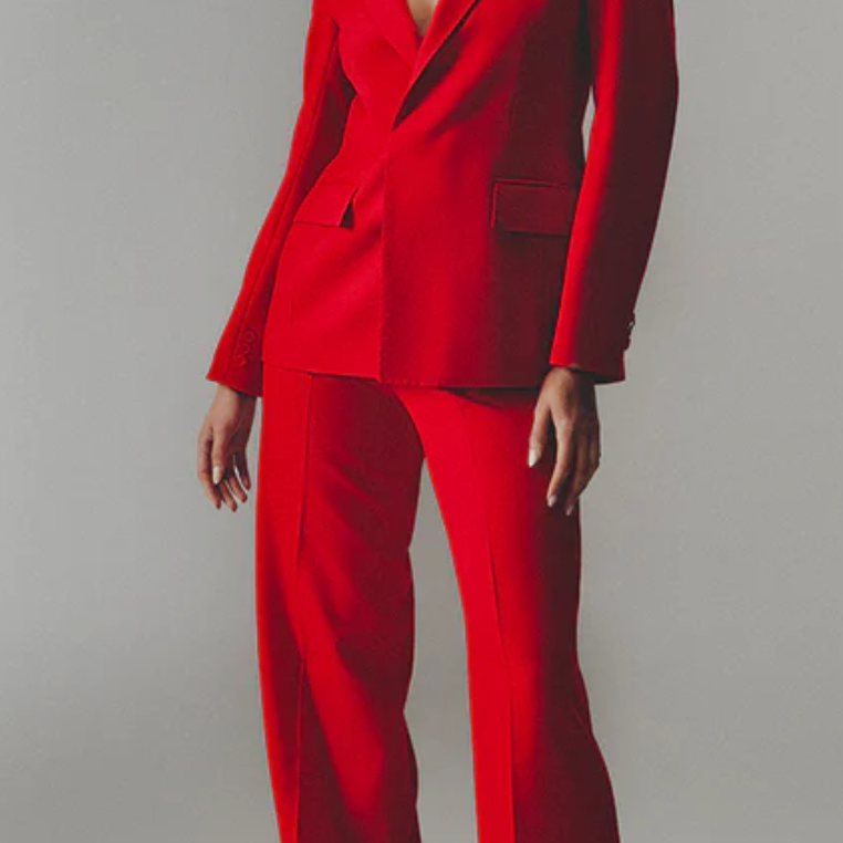 Model wearing red wool pants and blazer