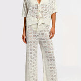 Matching white crochet top and pants on a white background.