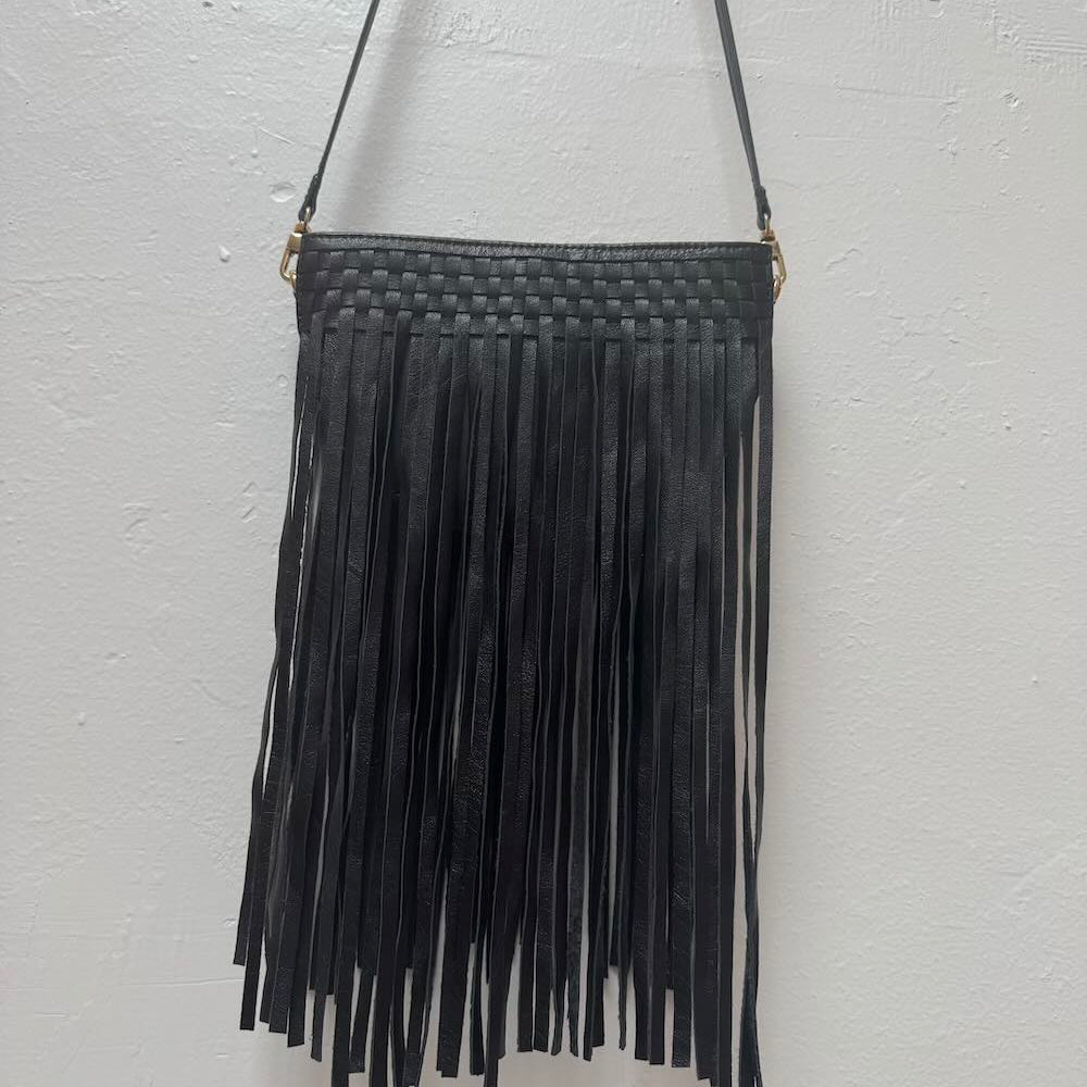 Black fringed handbag on a white background.