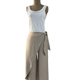 Mannequin wearing a white tank top and beige wrap skirt on a white background