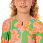 Child wearing a colorful floral swimsuit on a white background