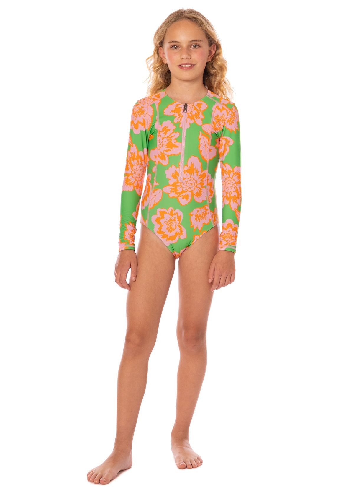 Young girl wearing a floral swimsuit on a white background