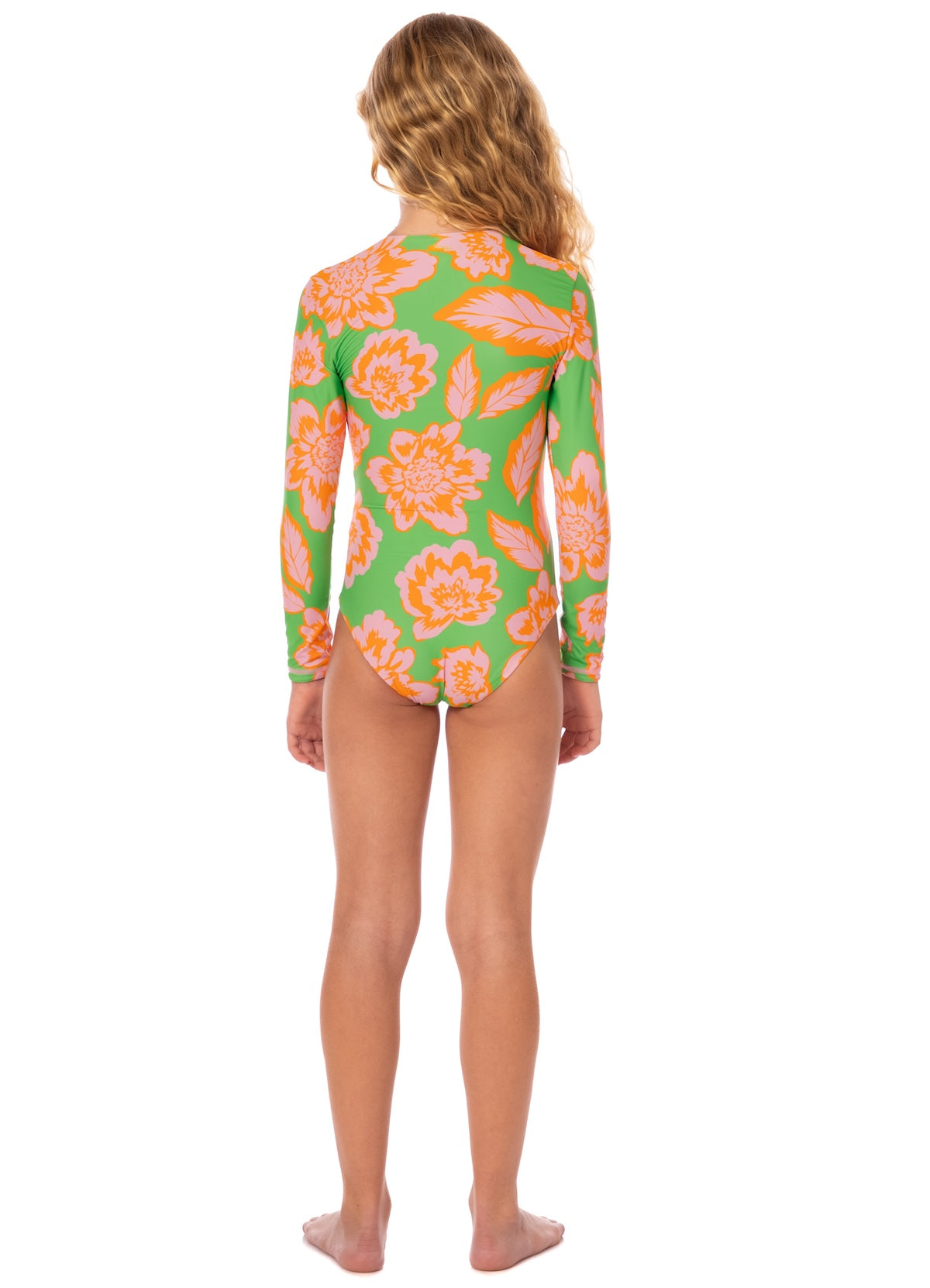 Girl wearing a green swimsuit with pink floral pattern on a white background