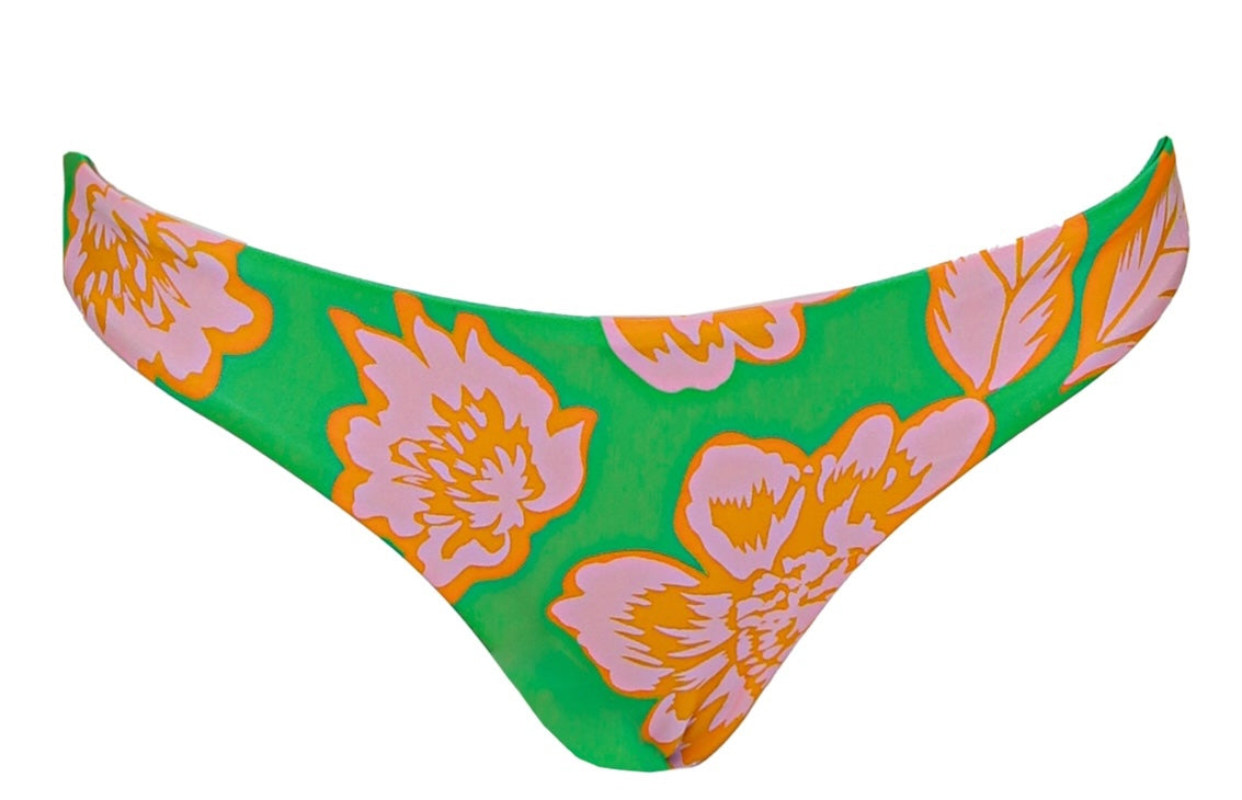 Floral-patterned bikini bottom on a green background.